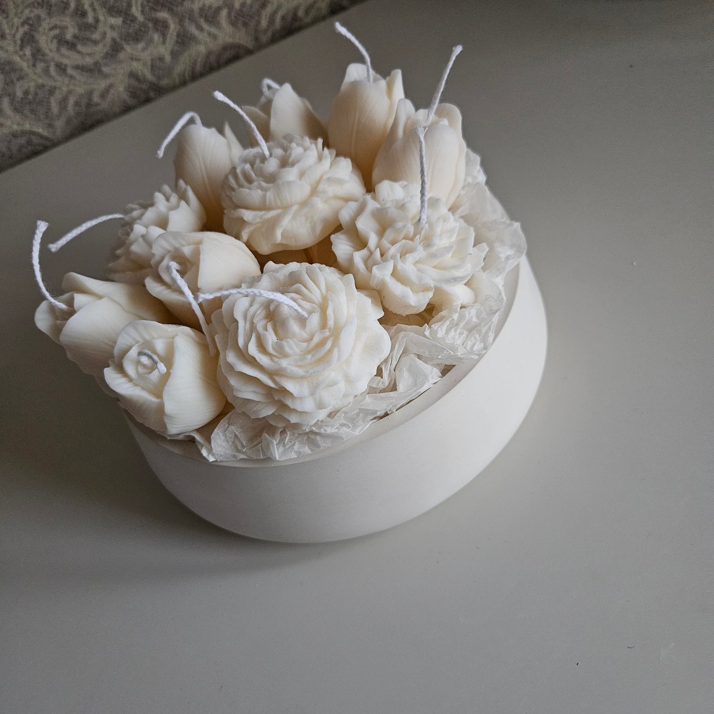 Candle flower bouquet in a plaster bowl peony, tulip and carnation
