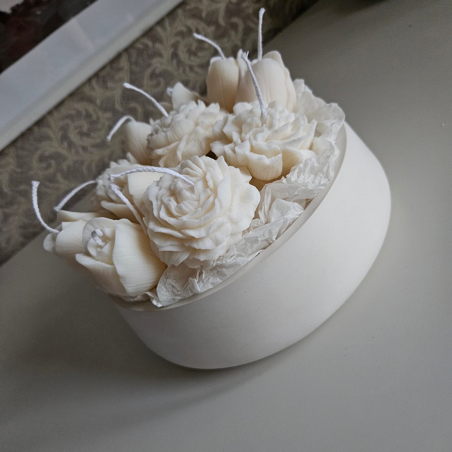Candle flower bouquet in a plaster bowl peony, tulip and carnation