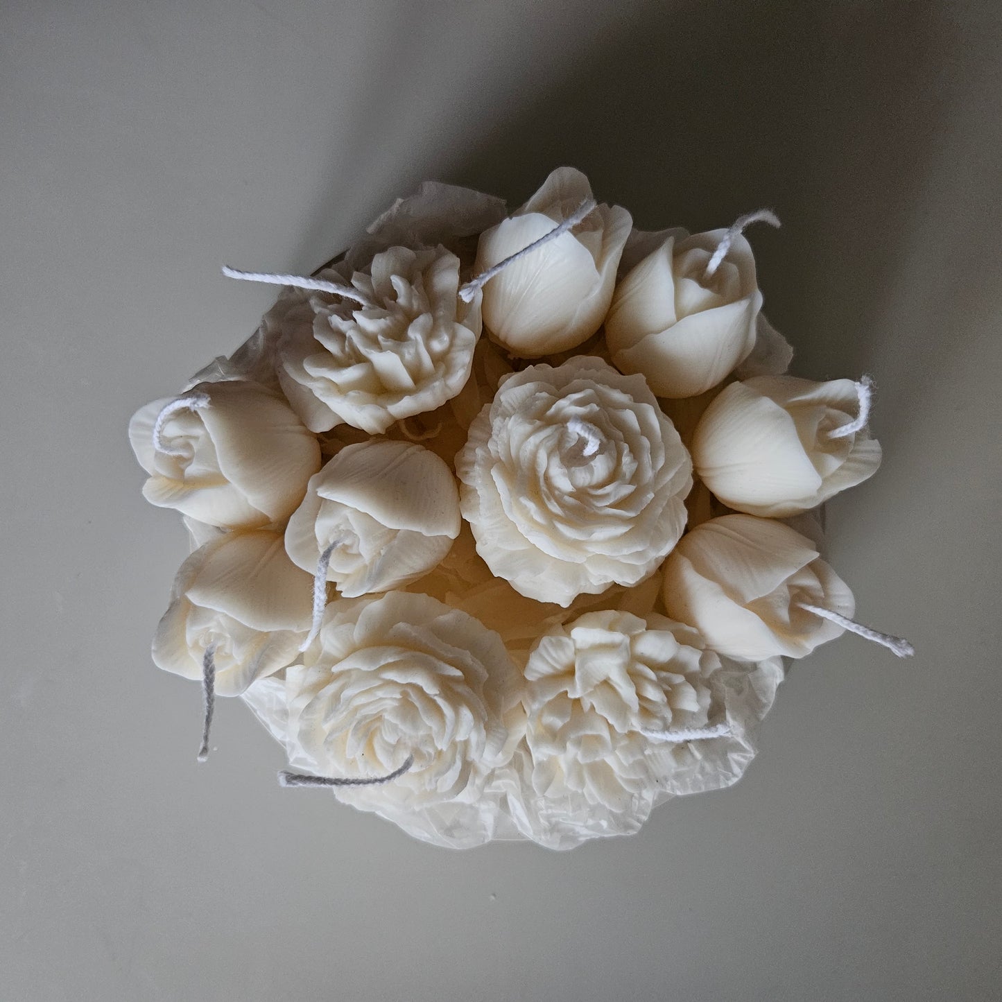 Candle flower bouquet in a plaster bowl peony, tulip and carnation
