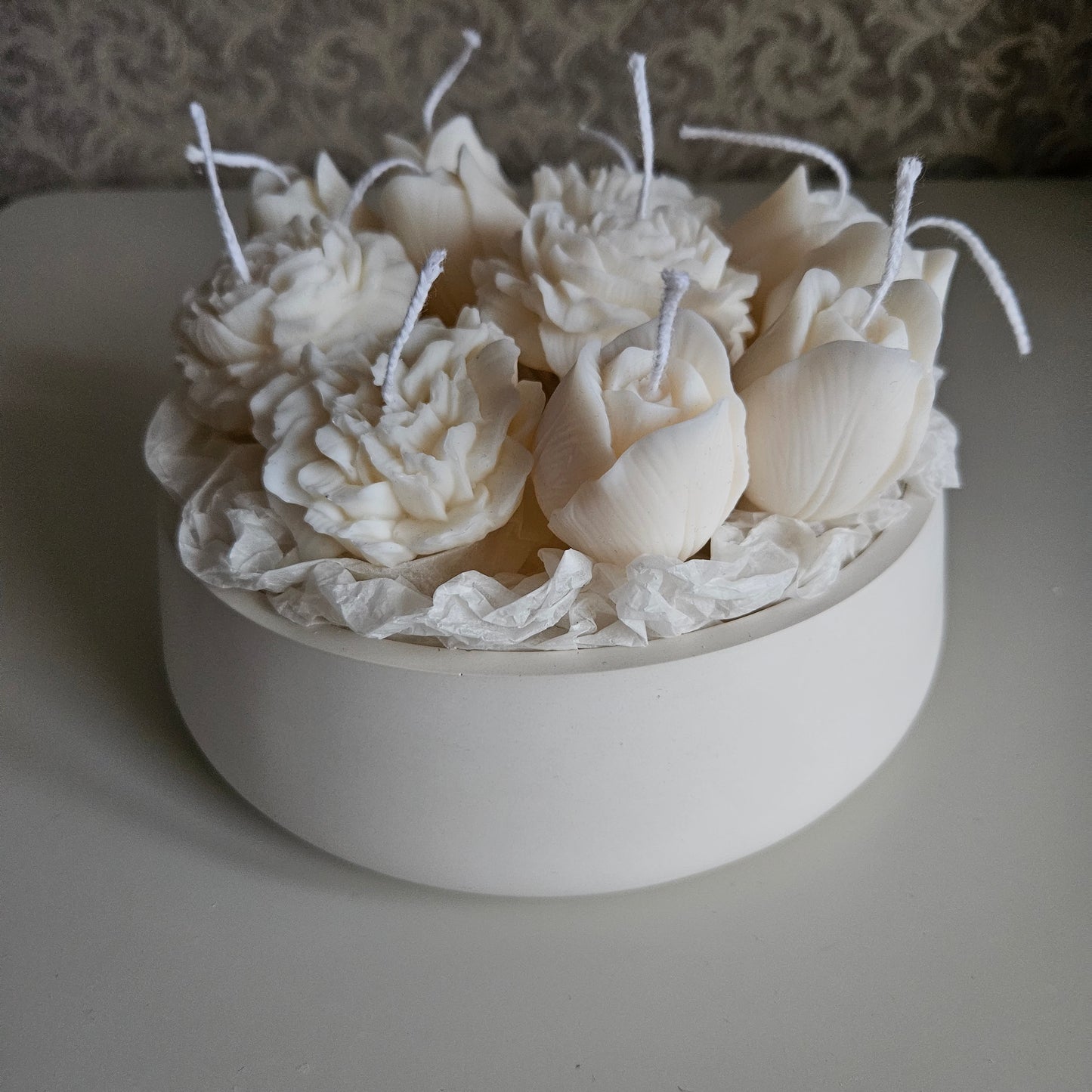 Candle flower bouquet in a plaster bowl peony, tulip and carnation