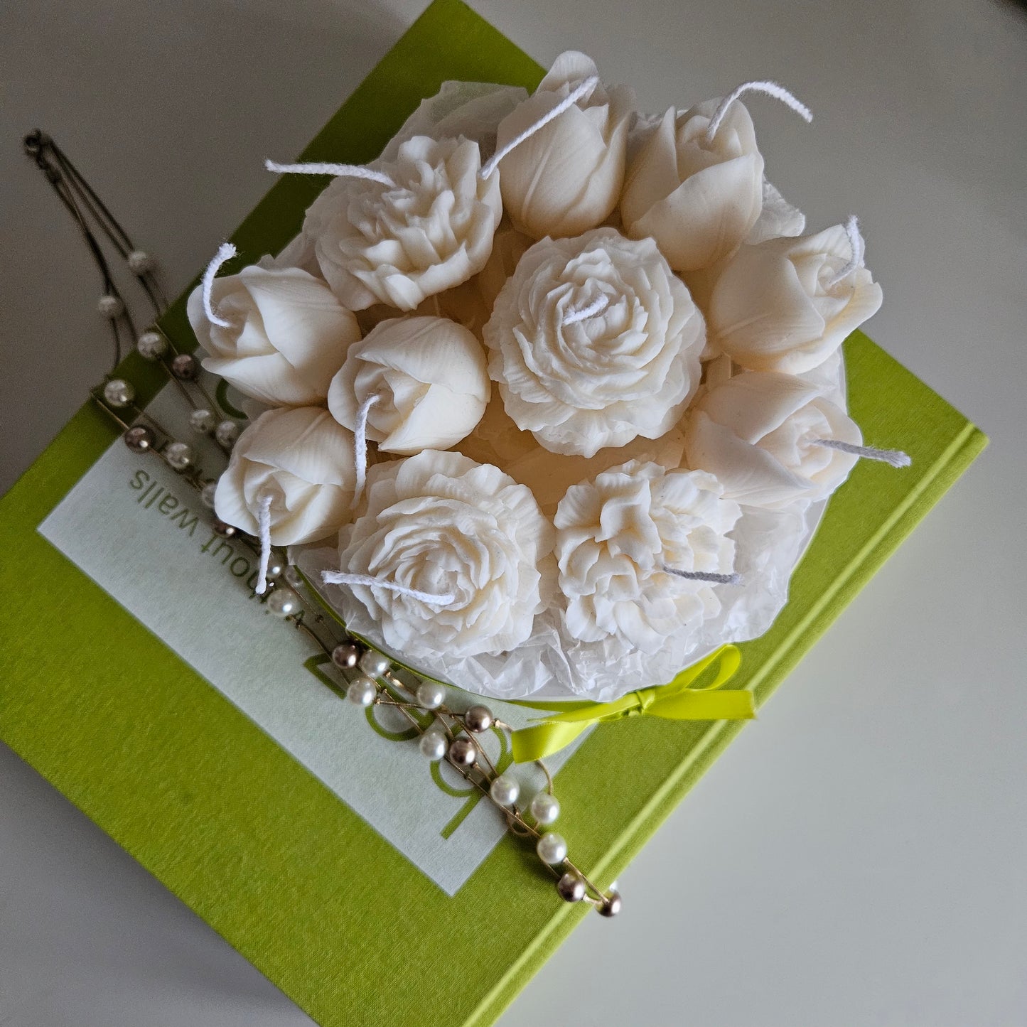 Candle flower bouquet in a plaster bowl peony, tulip and carnation