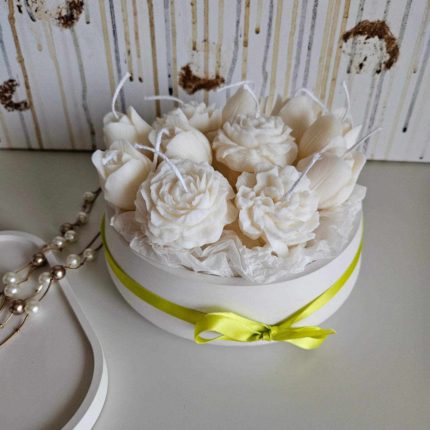 Candle flower bouquet in a plaster bowl peony, tulip and carnation