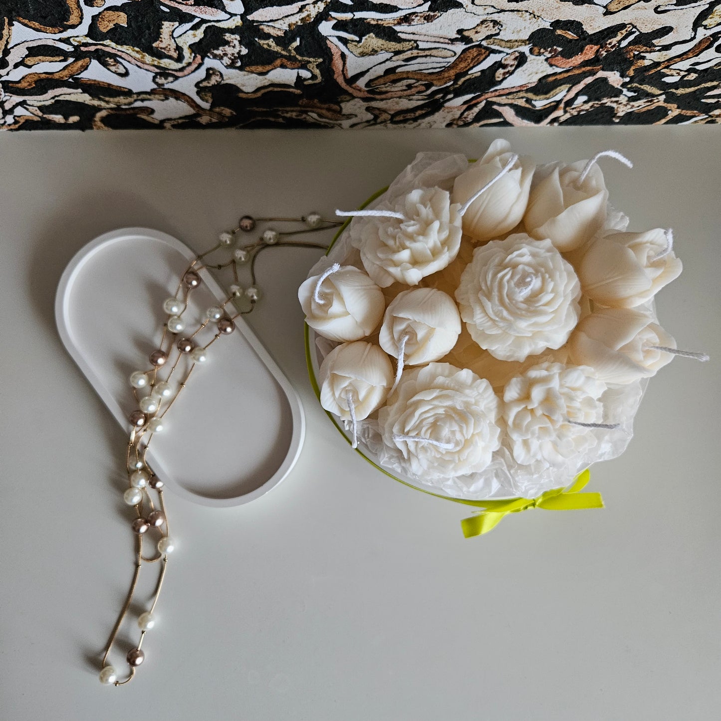 Candle flower bouquet in a plaster bowl peony, tulip and carnation