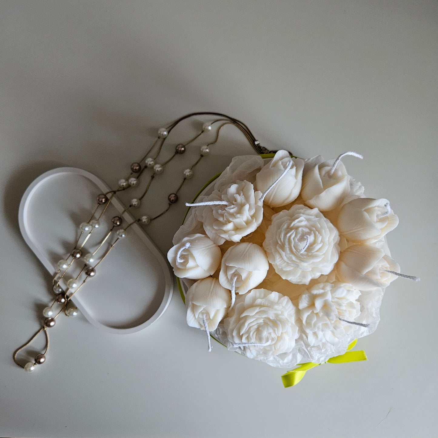 Candle flower bouquet in a plaster bowl peony, tulip and carnation