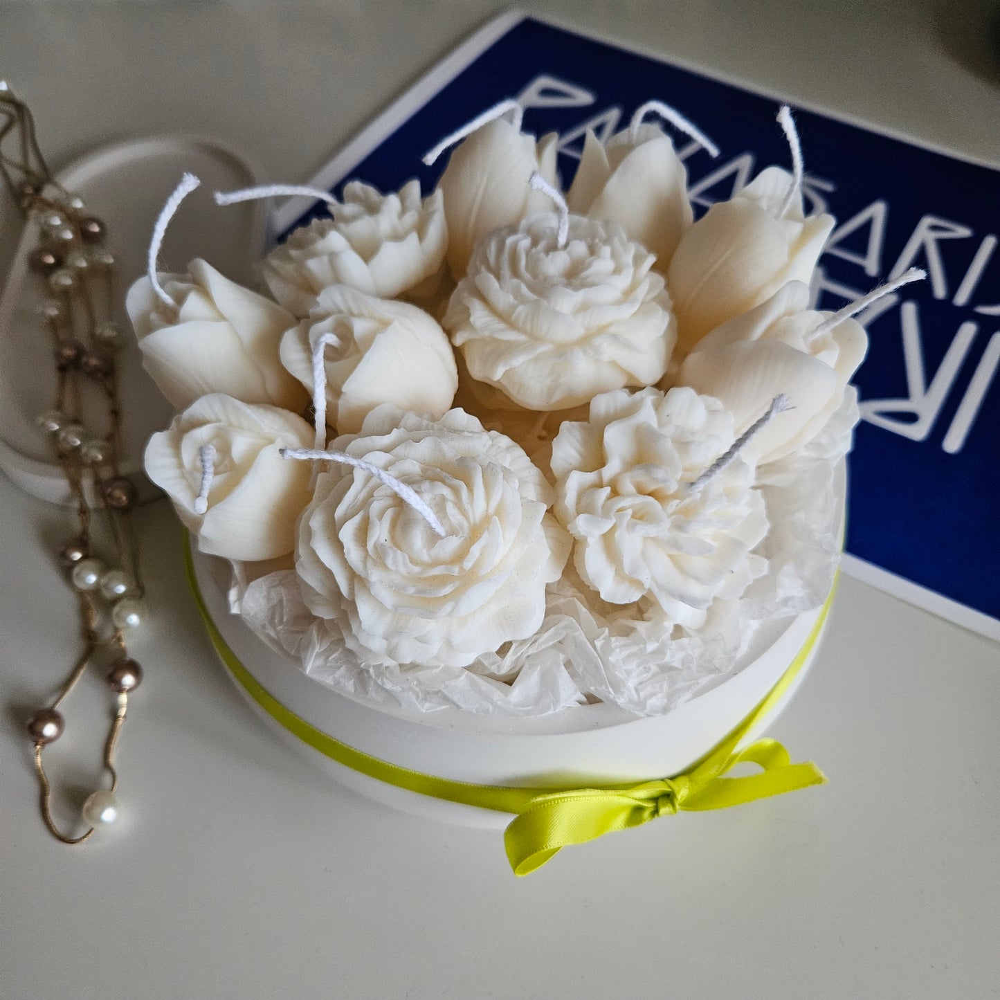 Candle flower bouquet in a plaster bowl peony, tulip and carnation