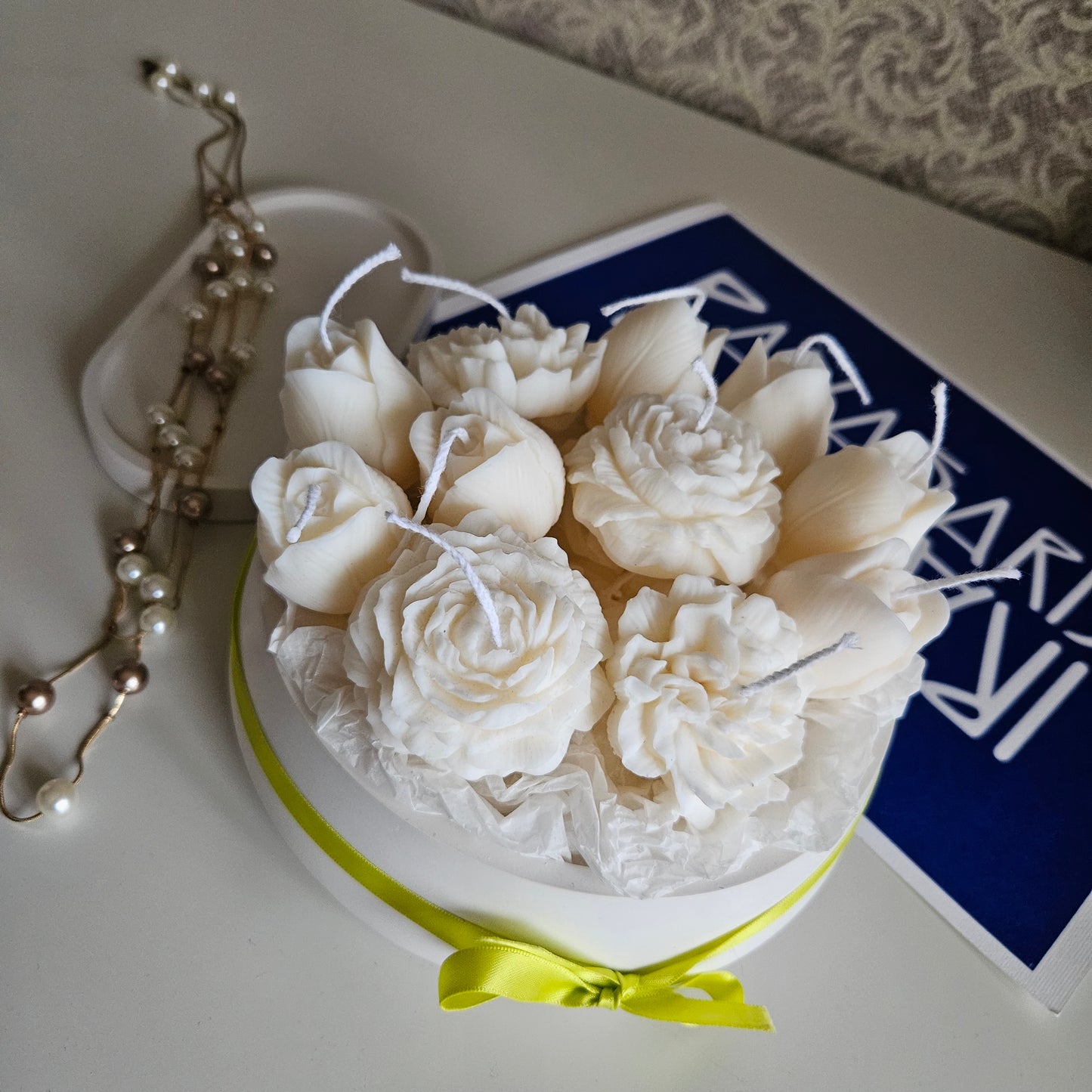 Candle flower bouquet in a plaster bowl peony, tulip and carnation