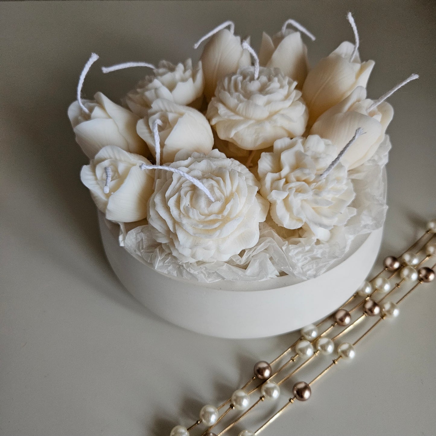 Candle flower bouquet in a plaster bowl peony, tulip and carnation