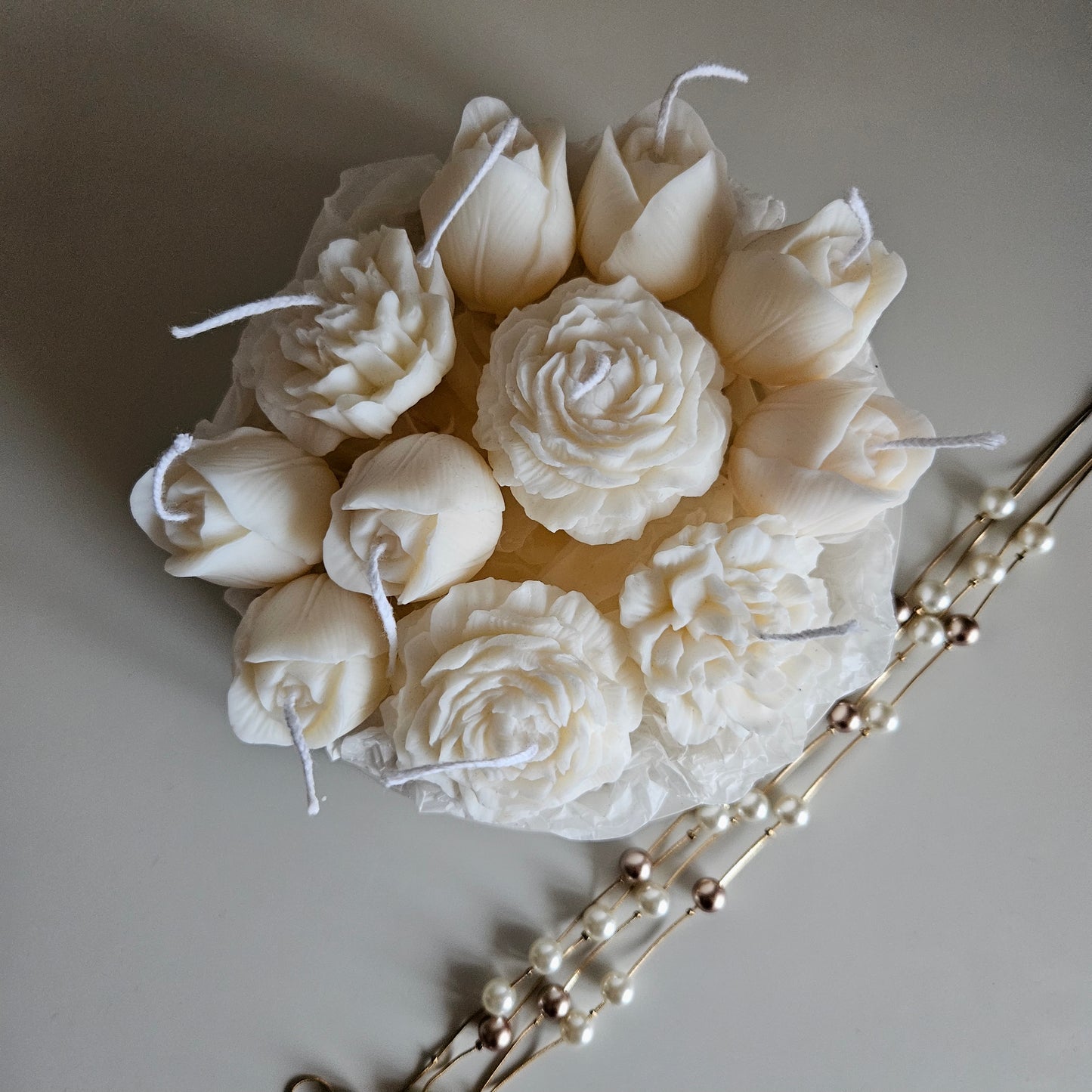 Candle flower bouquet in a plaster bowl peony, tulip and carnation