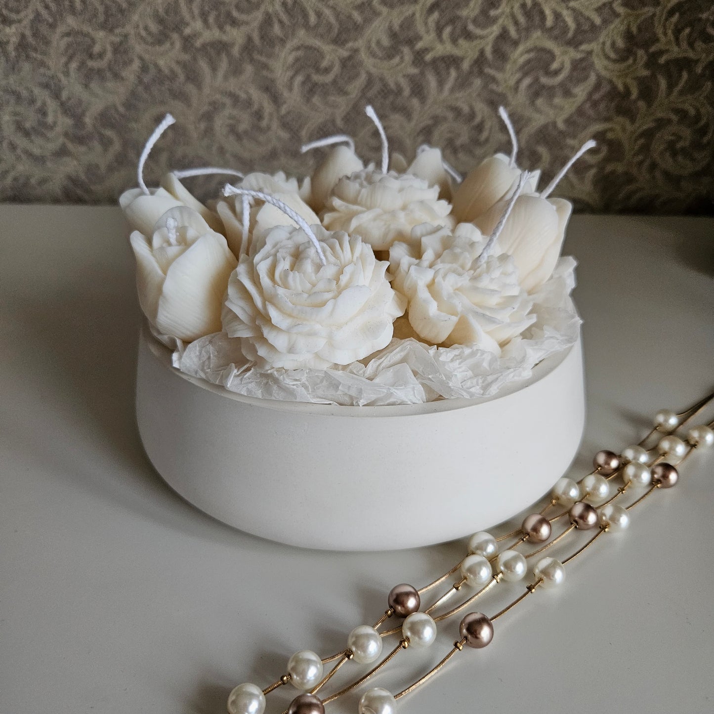 Candle flower bouquet in a plaster bowl peony, tulip and carnation