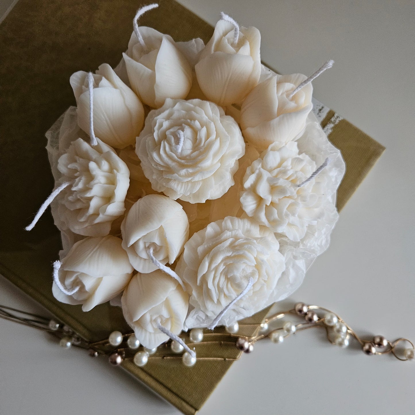 Candle flower bouquet in a plaster bowl peony, tulip and carnation