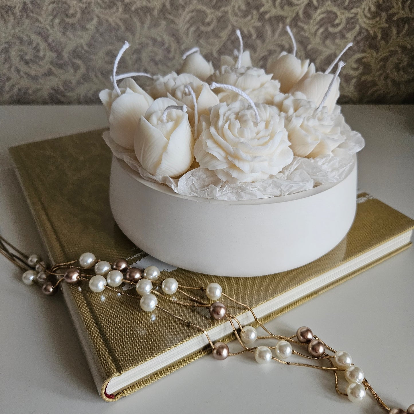 Candle flower bouquet in a plaster bowl peony, tulip and carnation