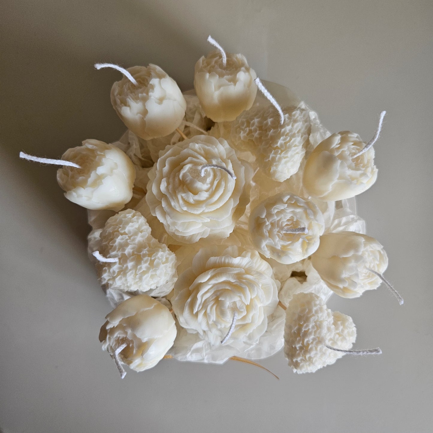 Candle flower bouquet in a plaster bowl peony and heart
