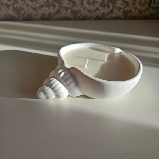 Flat seashell candle