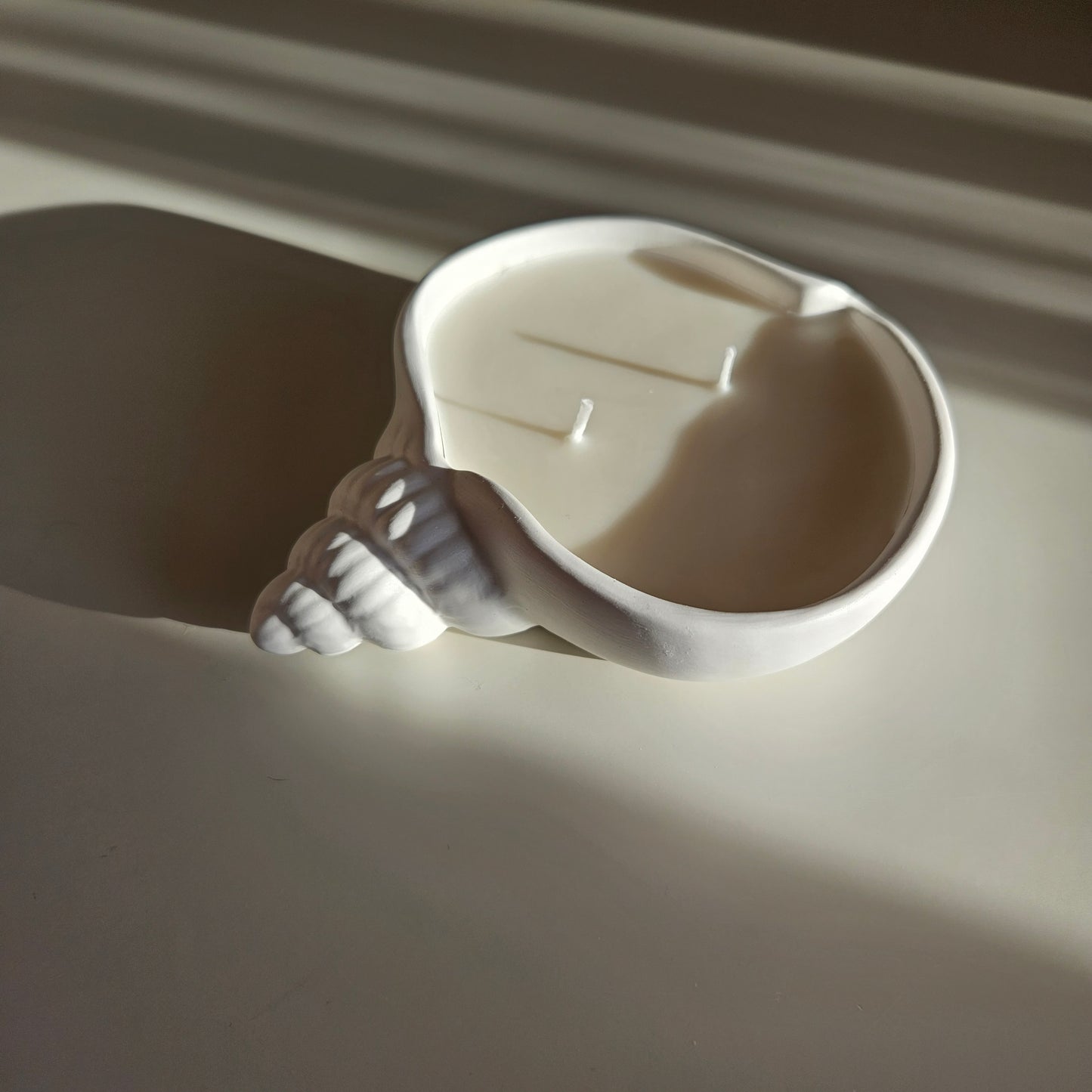 Flat seashell candle
