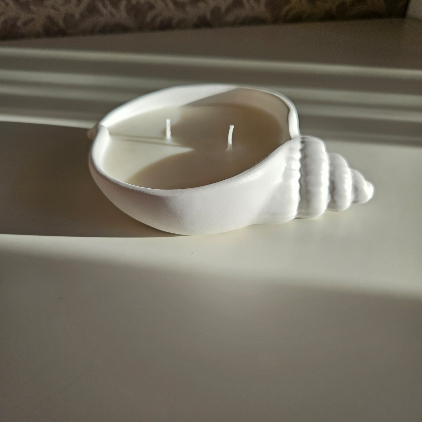 Flat seashell candle