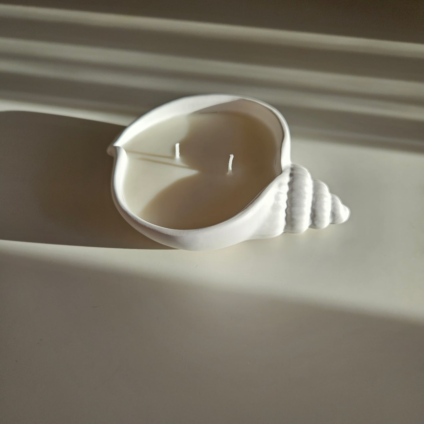 Flat seashell candle